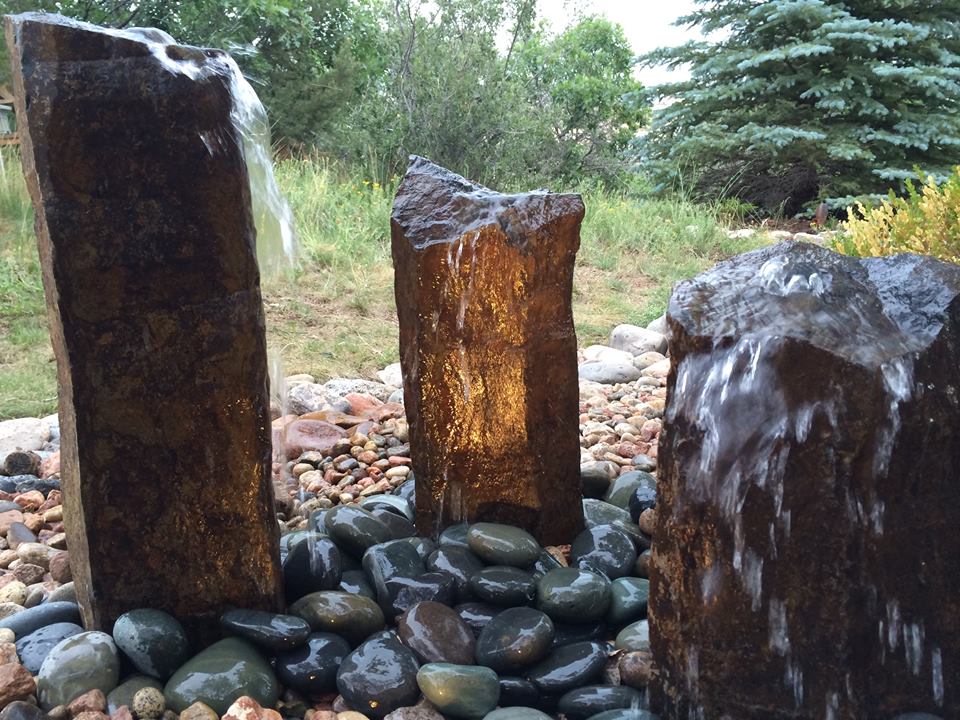 Water Feature with Pillars and river rock