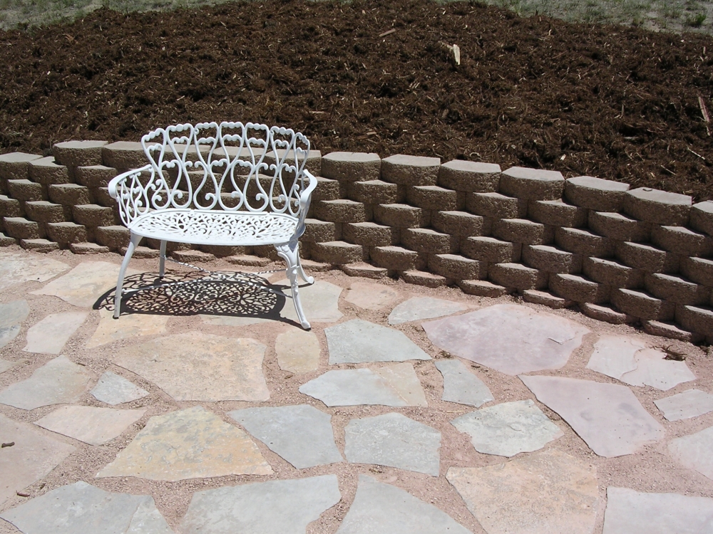 Flagstone Patio with Old Castle Retaining Wall and Bench